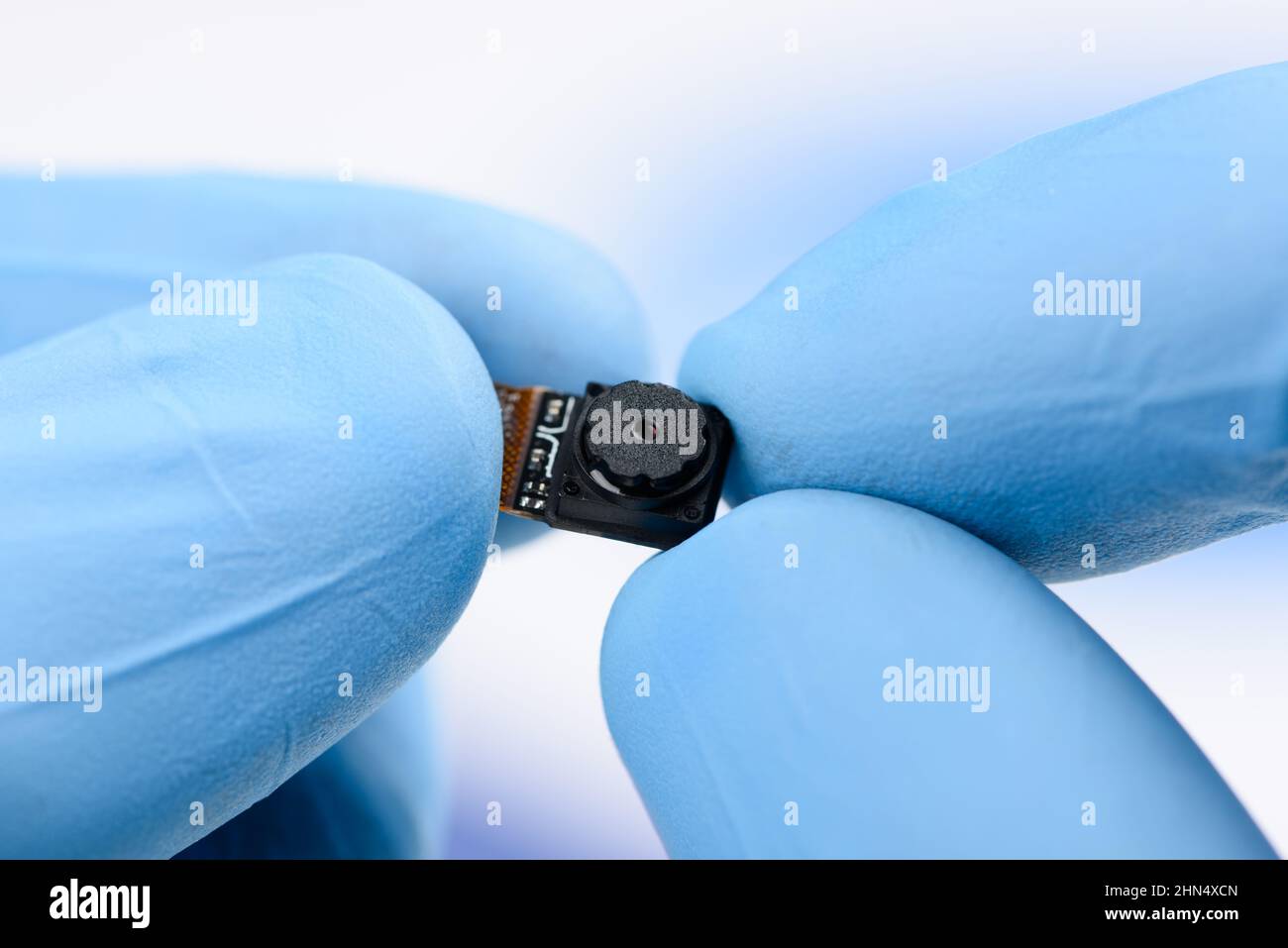 Camera module in scientist hands. Stock Photo