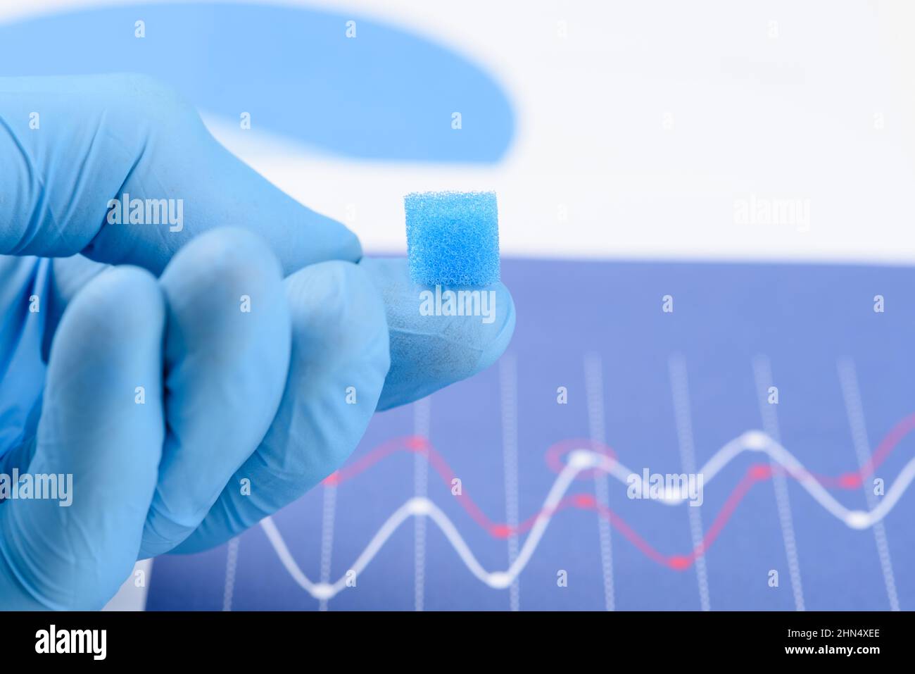 https://c8.alamy.com/comp/2HN4XEE/light-porous-foam-sponge-material-on-scientist-fingertip-research-for-material-with-new-properties-concept-2HN4XEE.jpg