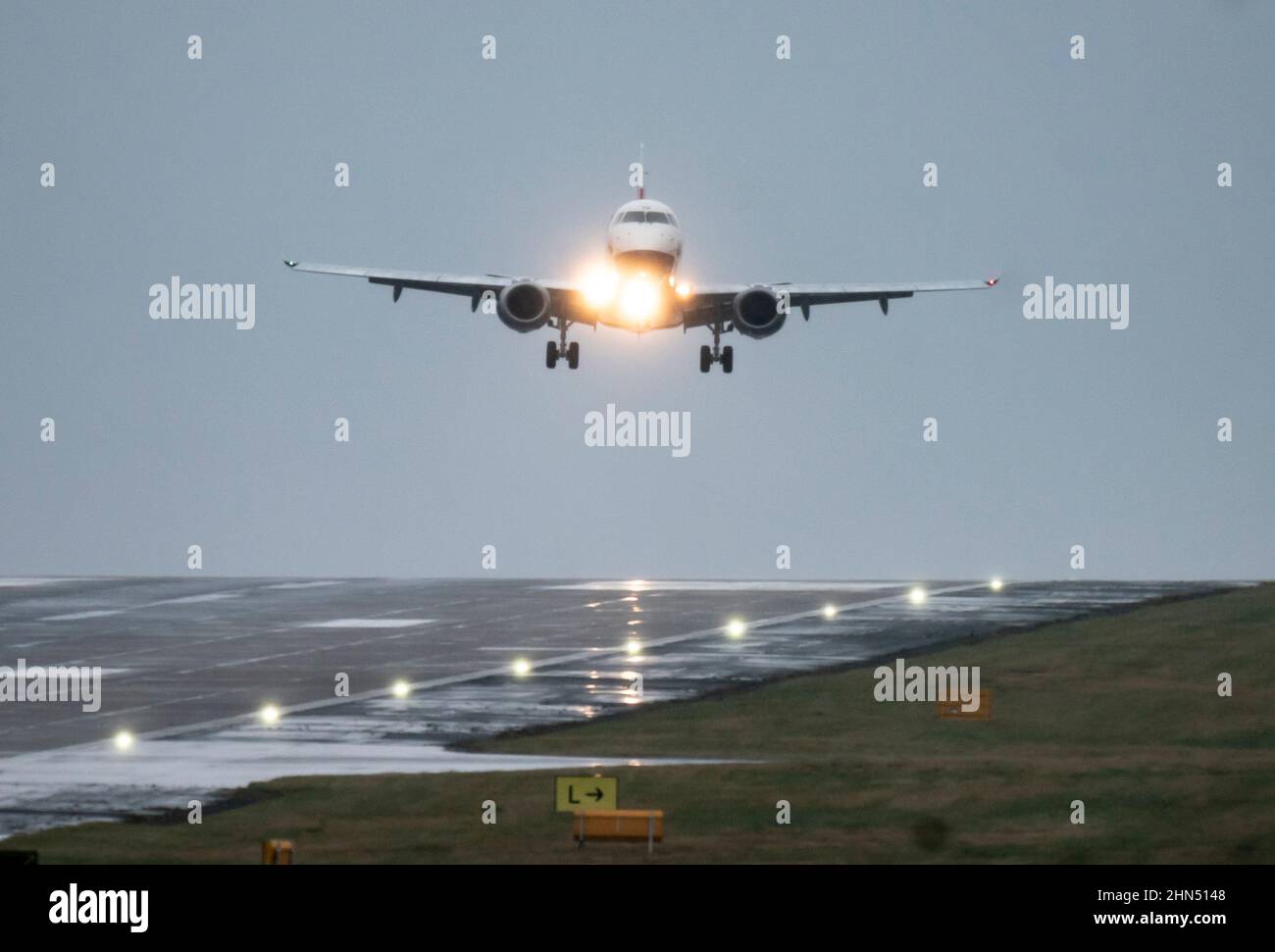 Flight BA7313 from Belfast City, lands in rainy and windy conditions at Leeds Bradford Airport in Yorkshire. Picture date: Monday February 14, 2022. Stock Photo