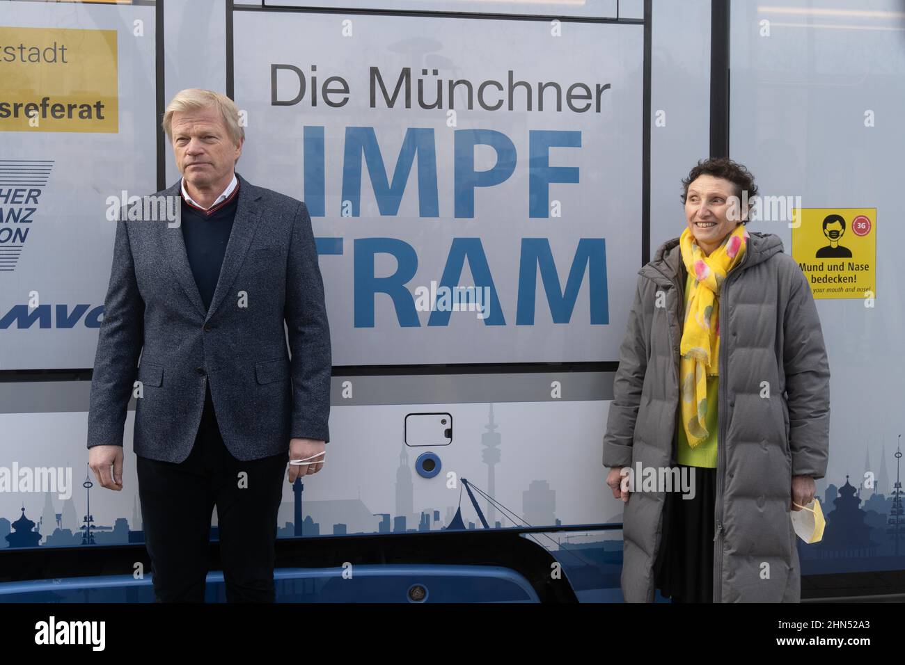 Munich, Germany. 14th Feb, 2022. Oliver Kahn and Beatrix Zurek in front of the tram. On February 14, 2022, the vaccination tram was presented in Munich, Germany. Participants were: Minister of State Klaus Holetschek, Mayor Verena Dietel, Oliver Kahn and Beatrix Zurek. (Photo by Alexander Pohl/Sipa USA) Credit: Sipa USA/Alamy Live News Stock Photo
