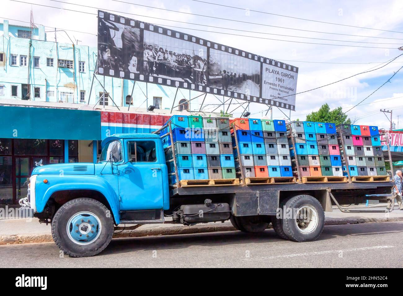 Old Russian Zyl truck distributing beer or carbonated soft drinks to a restaurant business. A sign with images of the Bay of Pigs combat are seen in t Stock Photo