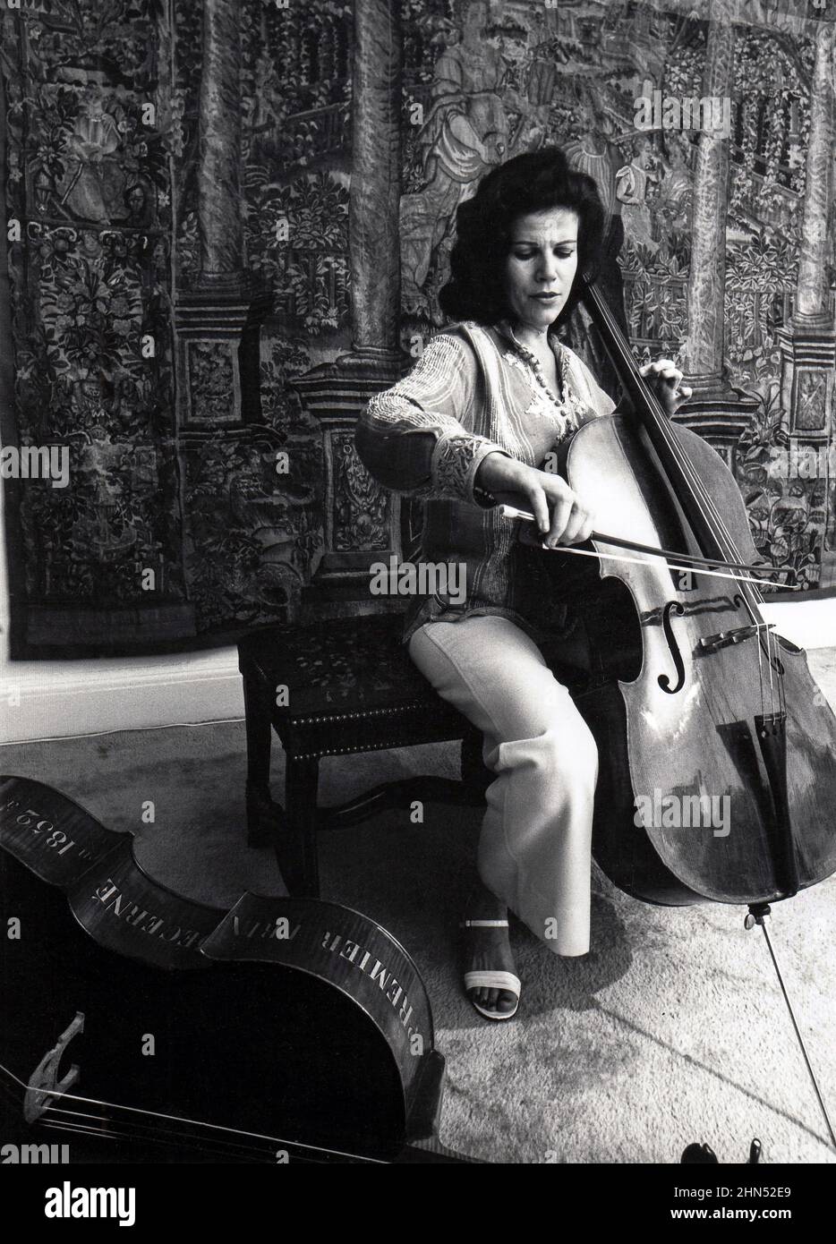 A portrait of the acclaimed cellist Christine Walevska who is best known for her many recordings with Philips Records. Called the 'Goddess of the Cello' she became the first concert musician to perform in Cuba under the Castro regime. This is a late 1970s portrait of her playing in her Manhattan apartment. Stock Photo