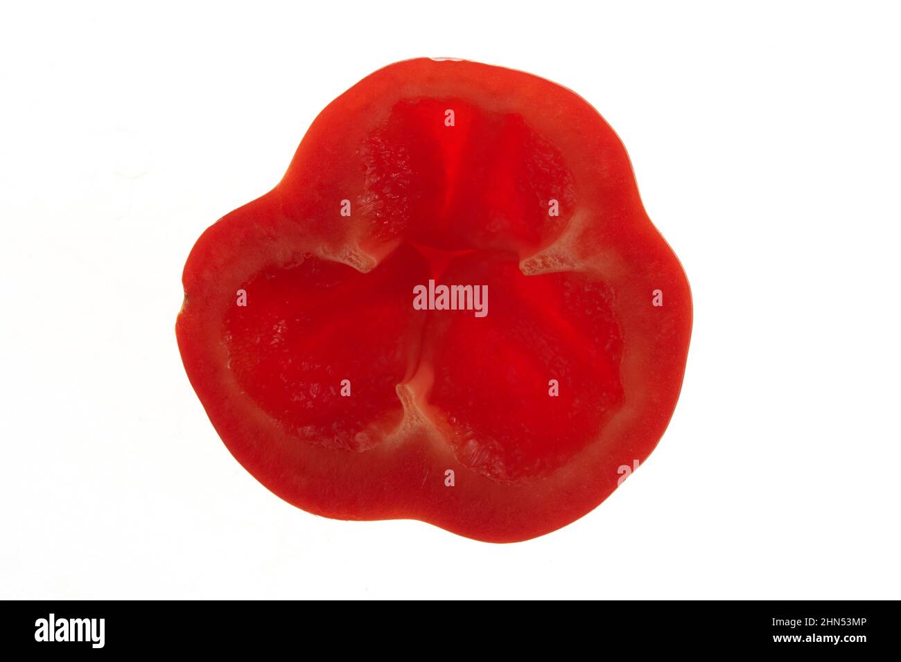 Close-up of a piece of sweet red bell pepper. Isolated on a white background. Top view. Detail of half a red pepper. High quality photo Stock Photo