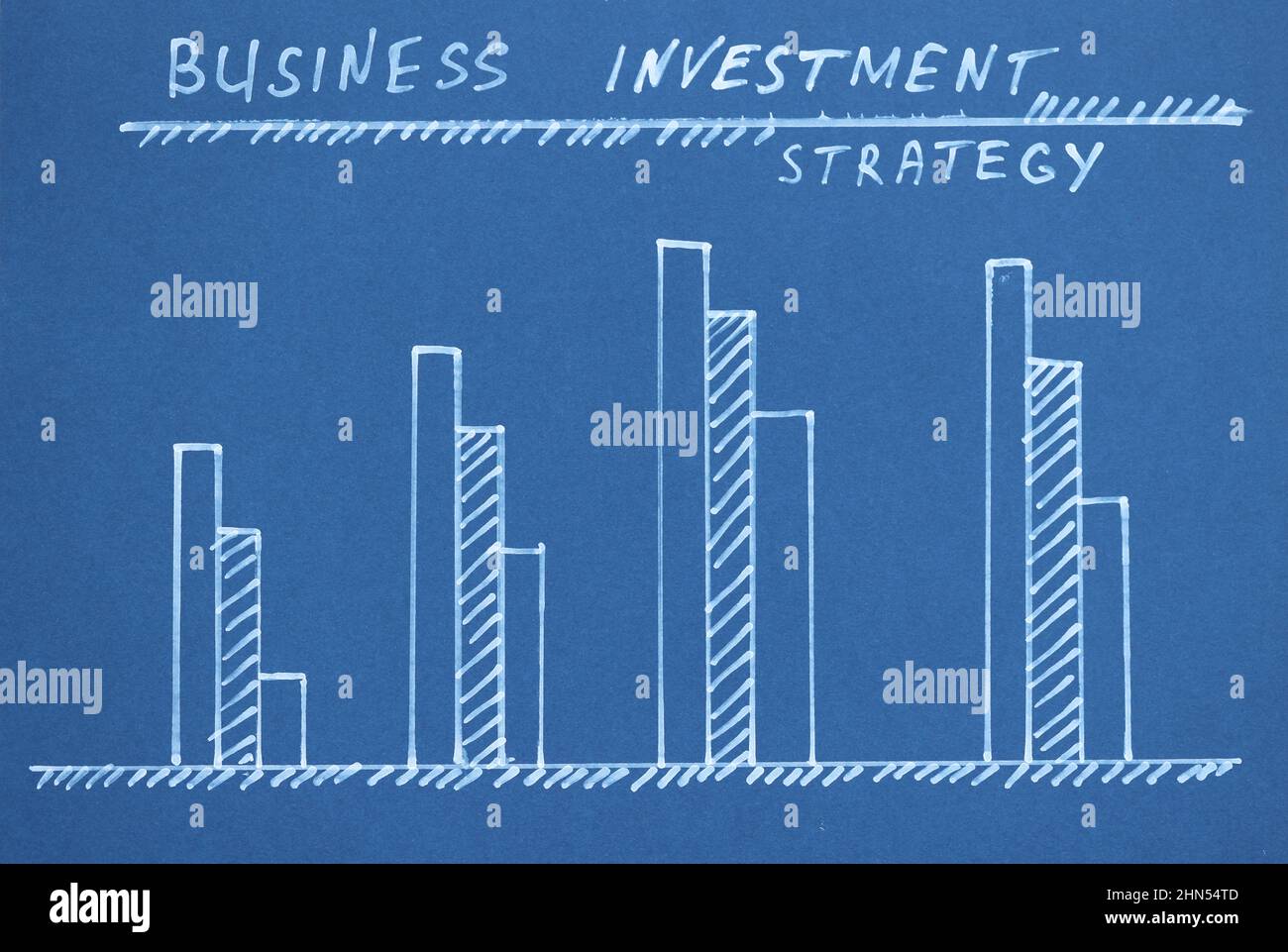 Chart growth indicators are drawn on blue background closeup Stock