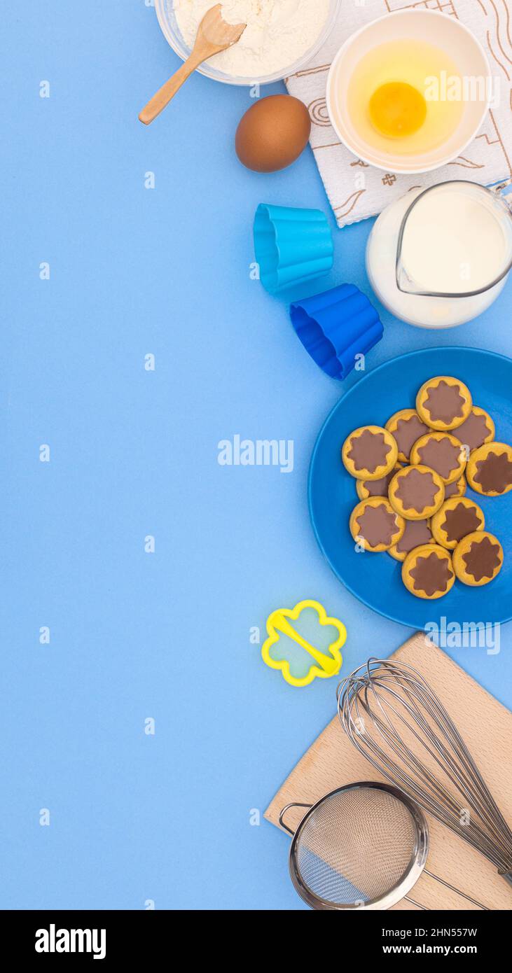 https://c8.alamy.com/comp/2HN557W/blue-background-with-ingredients-for-baking-cookies-flat-lay-creative-copy-space-cooking-dessert-concept-2HN557W.jpg