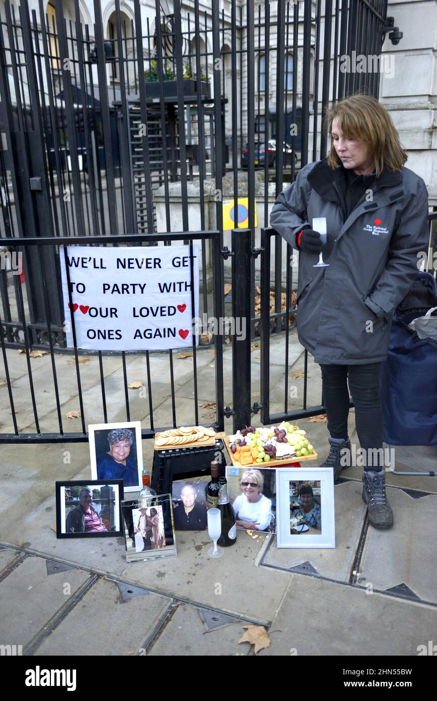 Members of 'Covid-19 Bereaved Families for Justice' holding a mock cheese and wine party outside Downing Street following the Partygate revelations... Stock Photo