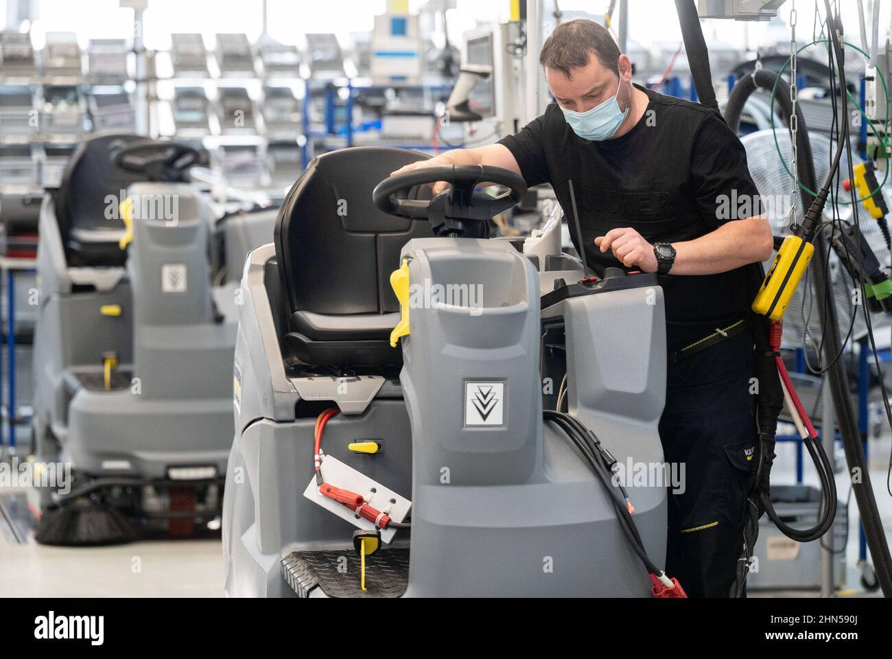 Winnenden, Germany. 14th Feb, 2022. An employee of the cleaning equipment  manufacturer Kärcher assembles a scrubber-dryer in production. Alfred  Kärcher SE & Co. KG announces its business figures for 2021. Credit: Marijan