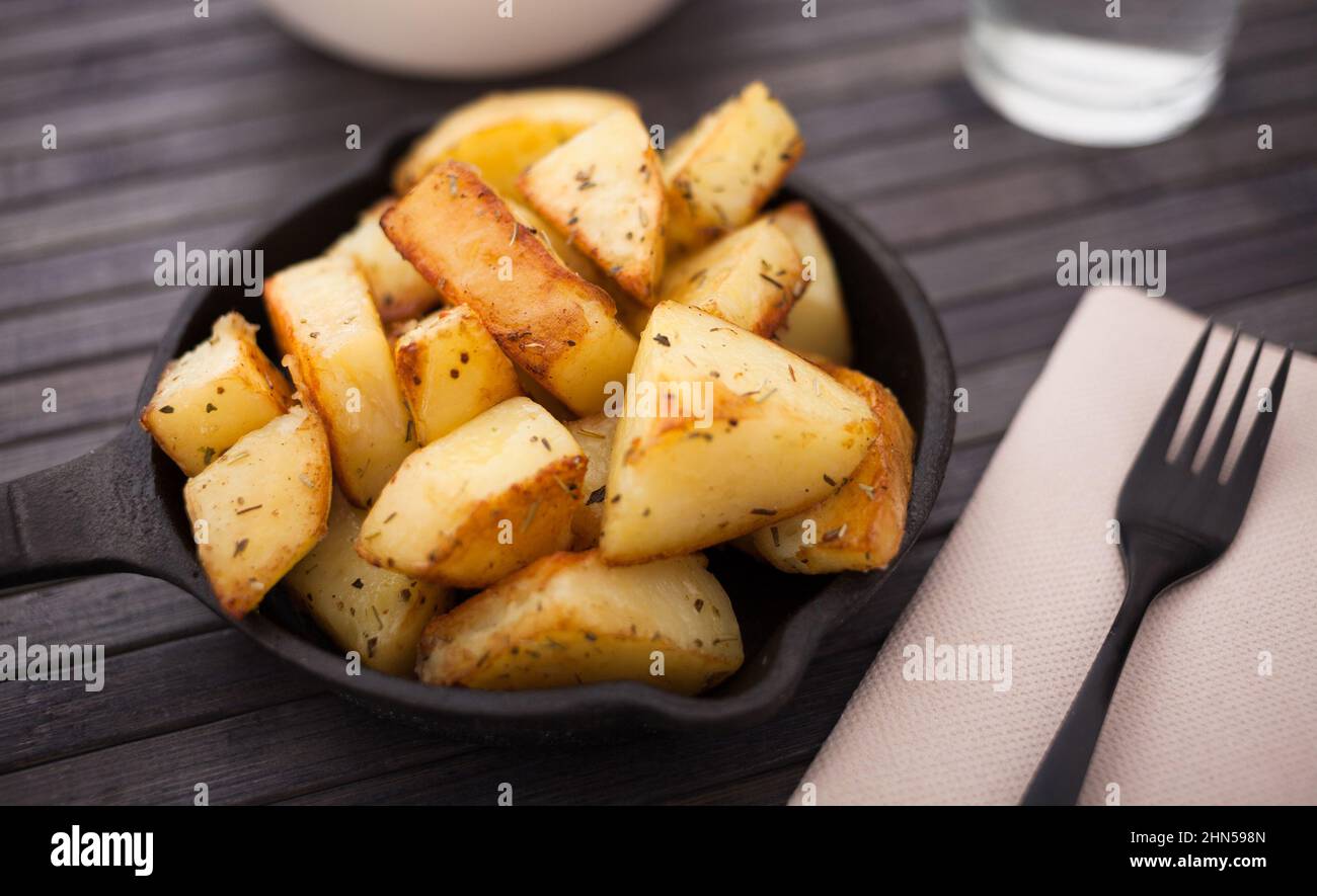 golden fried potatoes on small cast iron skillet Stock Photo Alamy