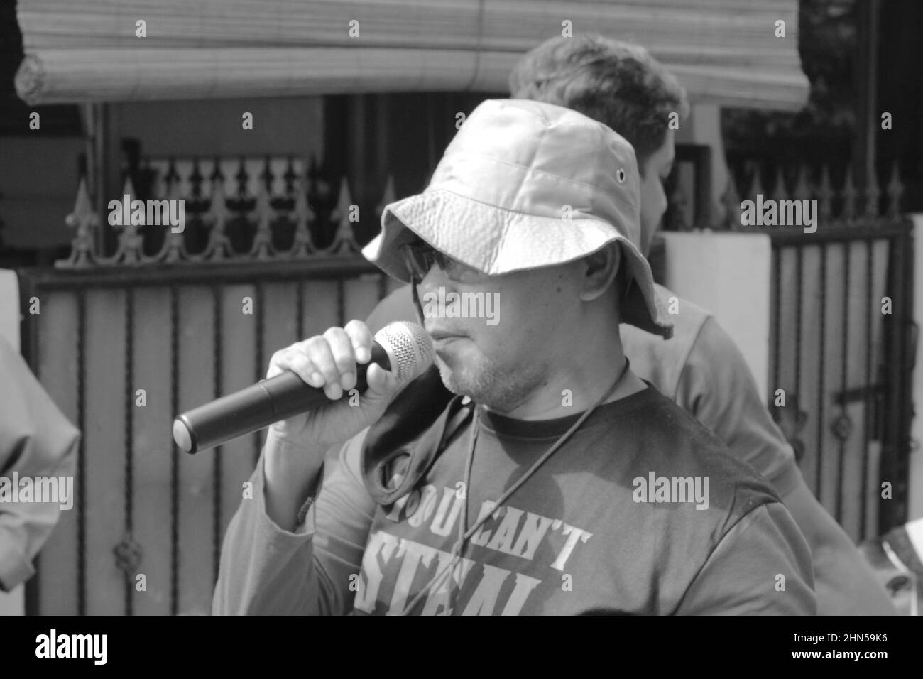 Jakarta, Indonesia - 07 31 2020: man speaking into a microphone to organize the commemoration of Eid al-Adha for Muslims Stock Photo