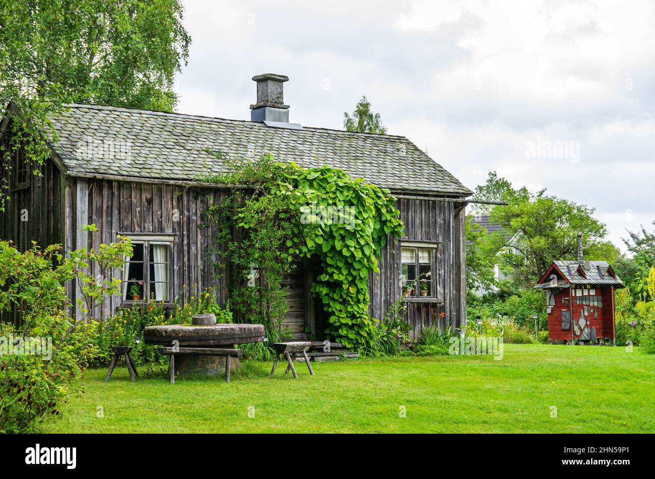 Dals Rostock, Dalsland, Västra Götalands län, Sweden: The picturesque herb garden with Kroppefjäll's museum of local history and a small café. Stock Photo