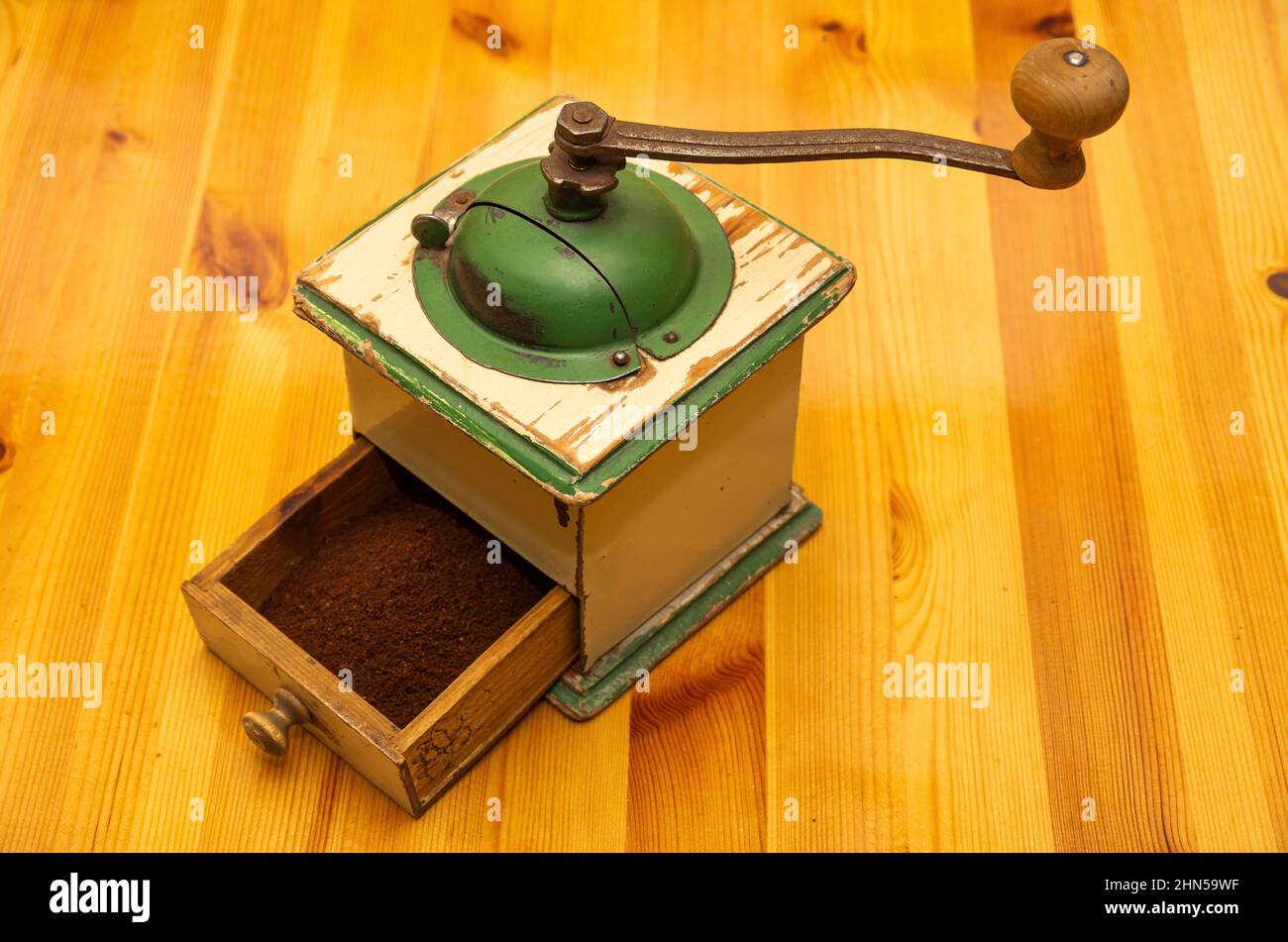 An old crankdriven manual burr mill for grinding coffee or similar