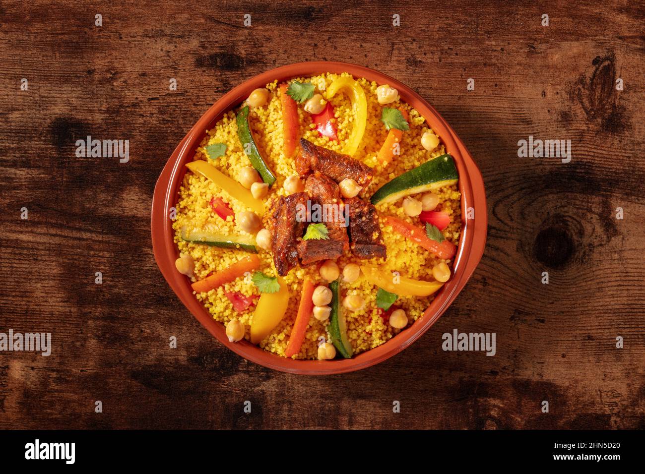 Meat and vegetable couscous, traditional Moroccan food, shot from the