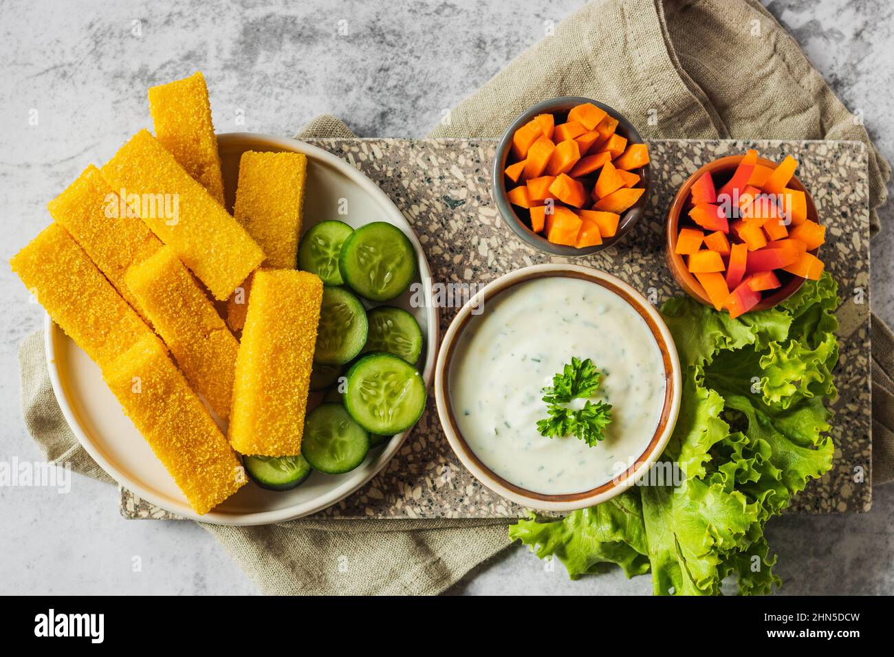 Homemade polenta chips fries with sea salt, parmesan, thyme, rosemary