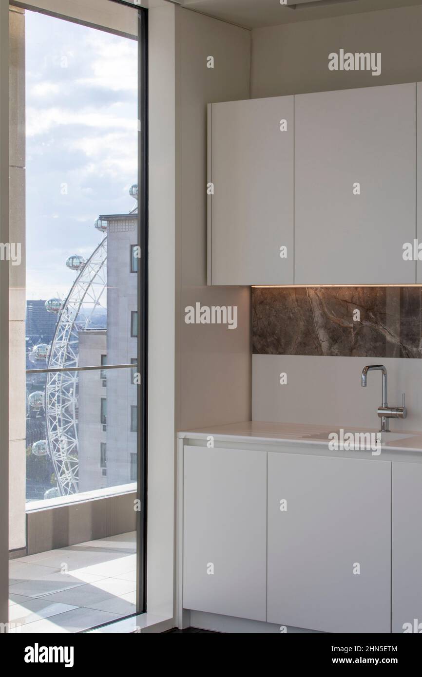14th floor apartment kitchen and window view. 8-13 Casson Square, London, United Kingdom. Architect: Patel Taylor Architects, 2022. Stock Photo