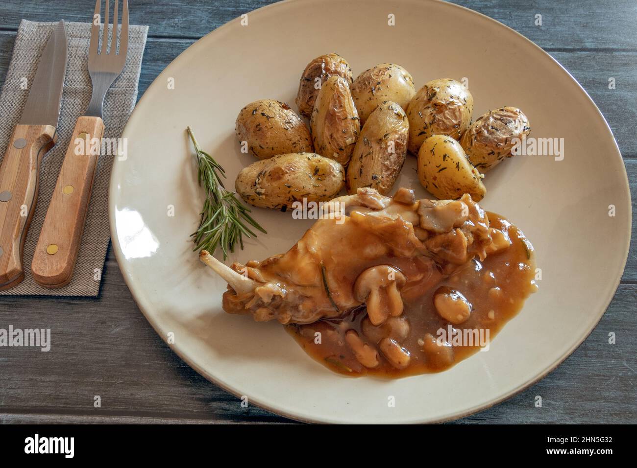 mushroom rabbit with new potatoes on a plate Stock Photo - Alamy