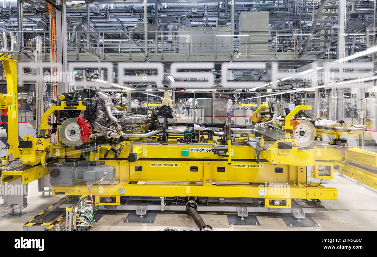 02 February 2022, Saxony, Leipzig: The chassis, engine, and powertrain of a Porsche go to what is known as a wedding to be joined to the body. The automaker will begin series production of the E version of its successful Macan model in Leipzig in 2023. In 2021, more than 88,000 Macans with internal combustion engines had been delivered to customers, it said. The conversion and expansion of the Leipzig plant is currently underway to prepare it for electromobility. Around 600 million euros are being invested, including in a new body shop and a dedicated axle production facility. Porsche is pursu Stock Photo