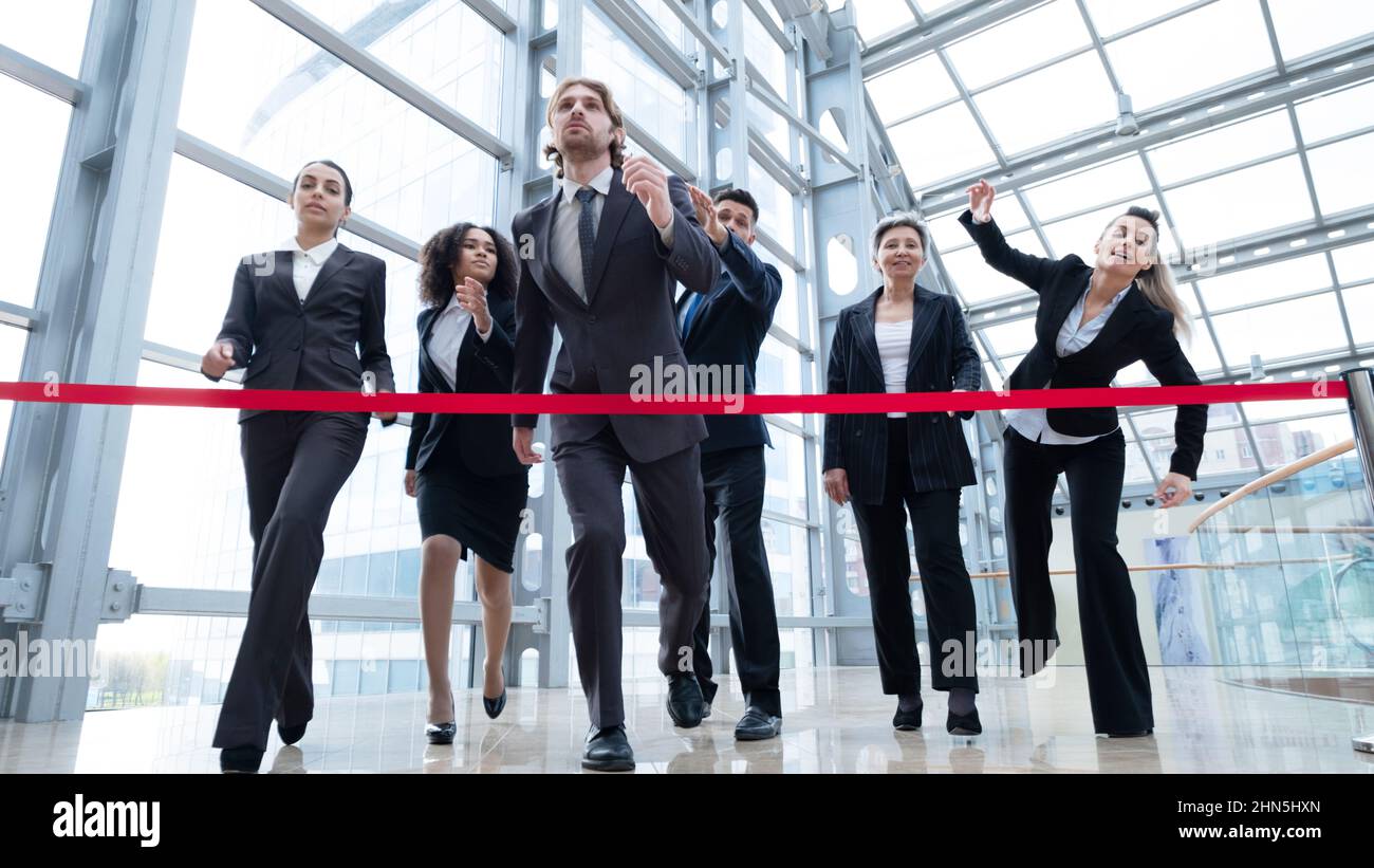 Businesspeople crossing the finish line rat race business people ...