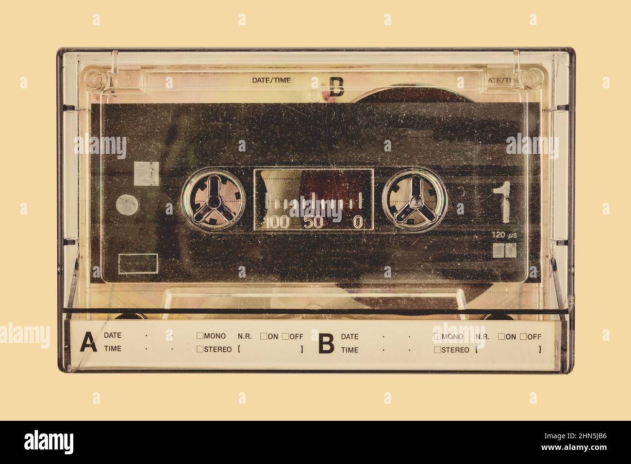 Retro styled image of a vintage audio compact cassette in a plastic