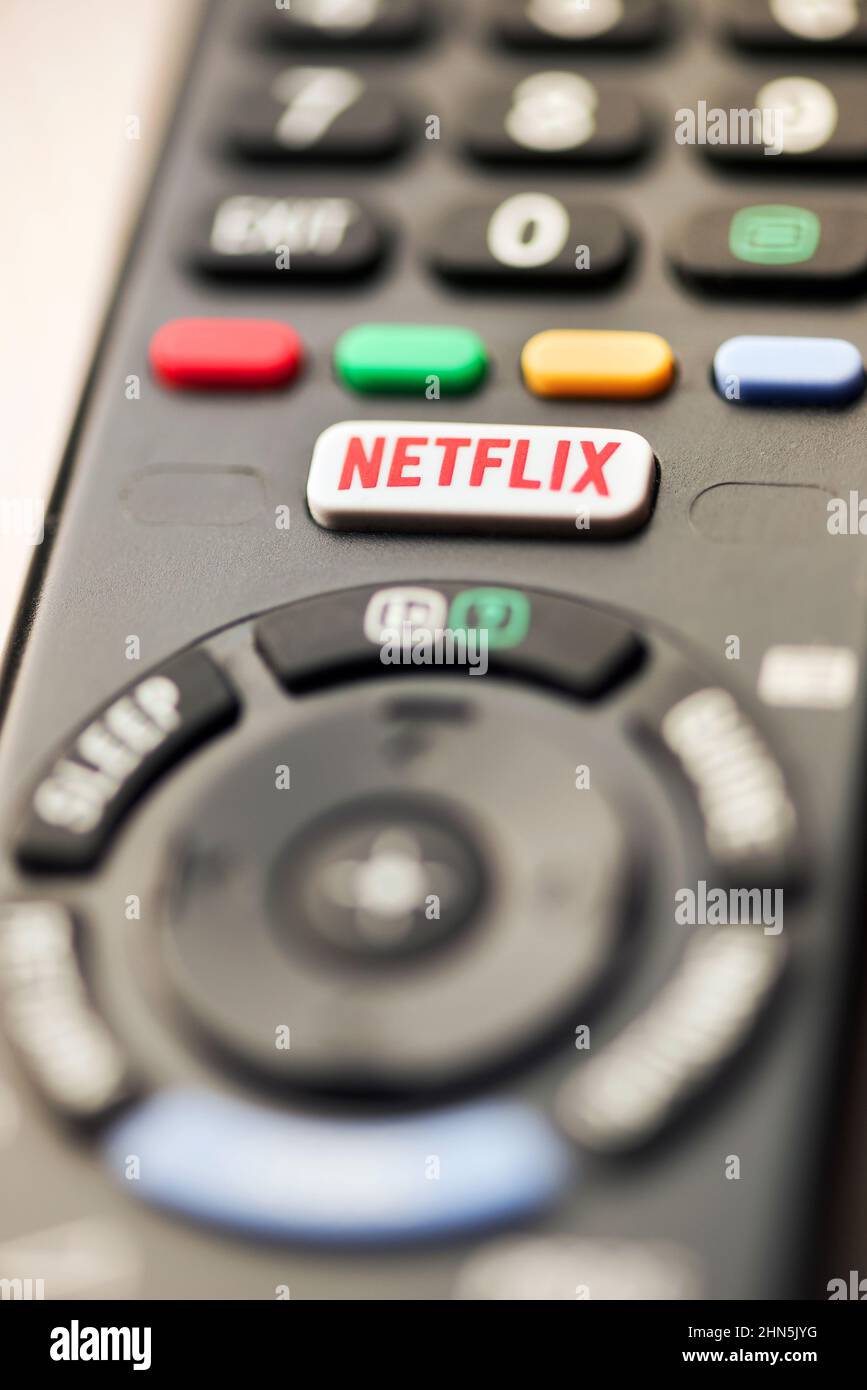 Netflix button on a TV remote control in close up selective focus conceptual of a media streaming subscription service and home entertainment Stock Photo