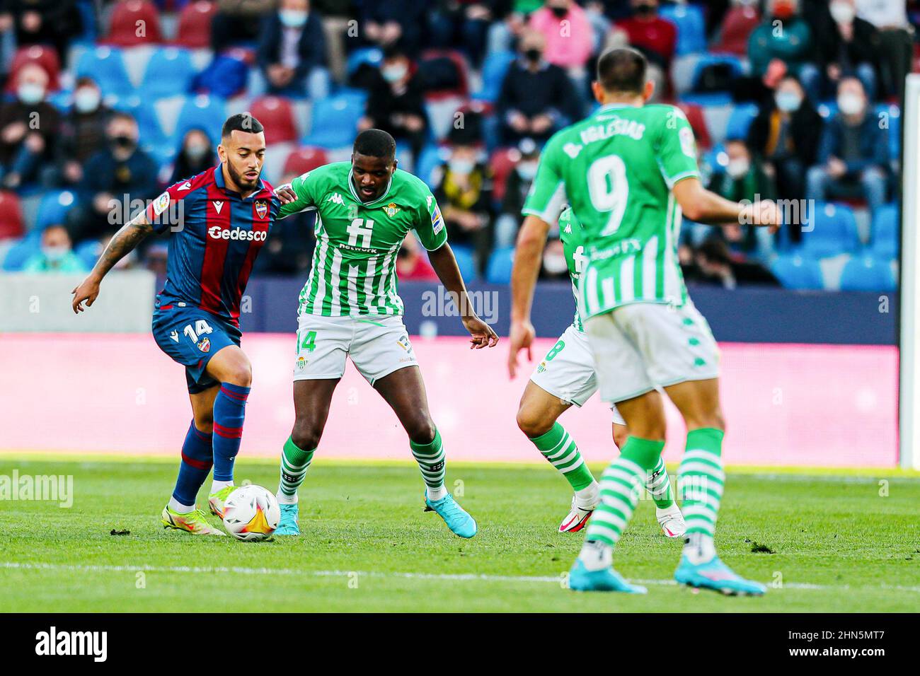 Ruben Vezo of Levante UD and William Carvalho of Real Betis during the Spanish championship La Liga football match between Levante UD and Real Betis Balompie on February 13, 2022 at the Ciutat de Valencia Stadium in Valencia, Spain - Photo: Ivan Terron/DPPI/LiveMedia Stock Photo
