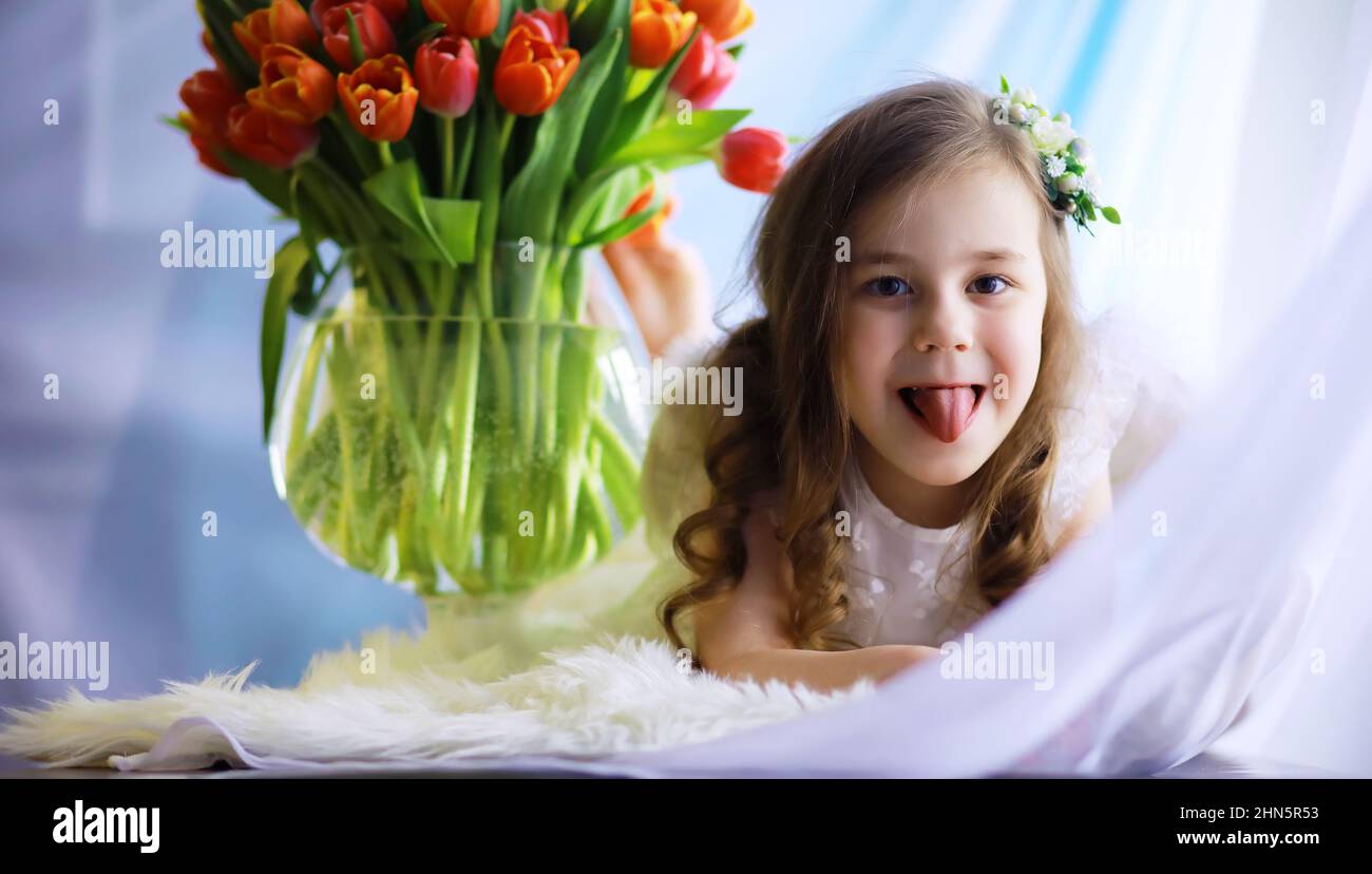 Beautiful girl in white dresses with a magnificent bouquet of first ...