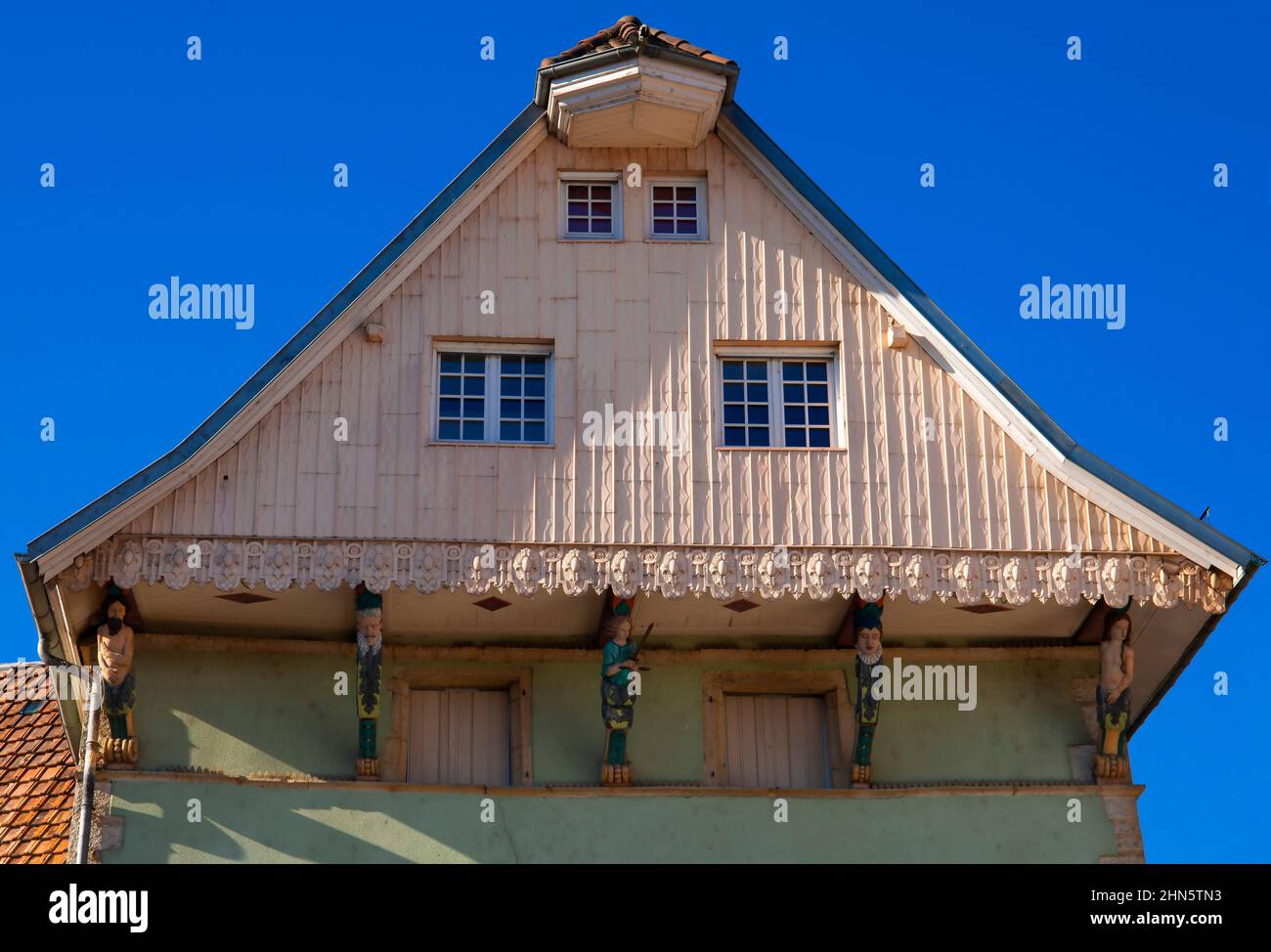 House of the Caryatids (Maison des Caryatids) in Delle old town, Burgundy, Franche-Comté, France. This beautiful building, almost unchanged since the Stock Photo