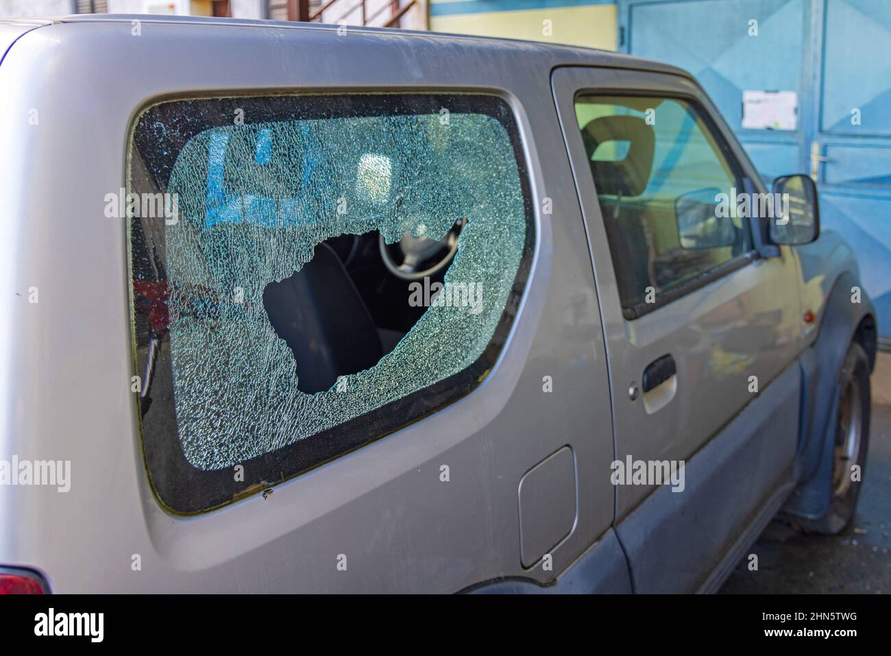 Broken in Small Car Side Window Glass Damage Exterior View Burglary
