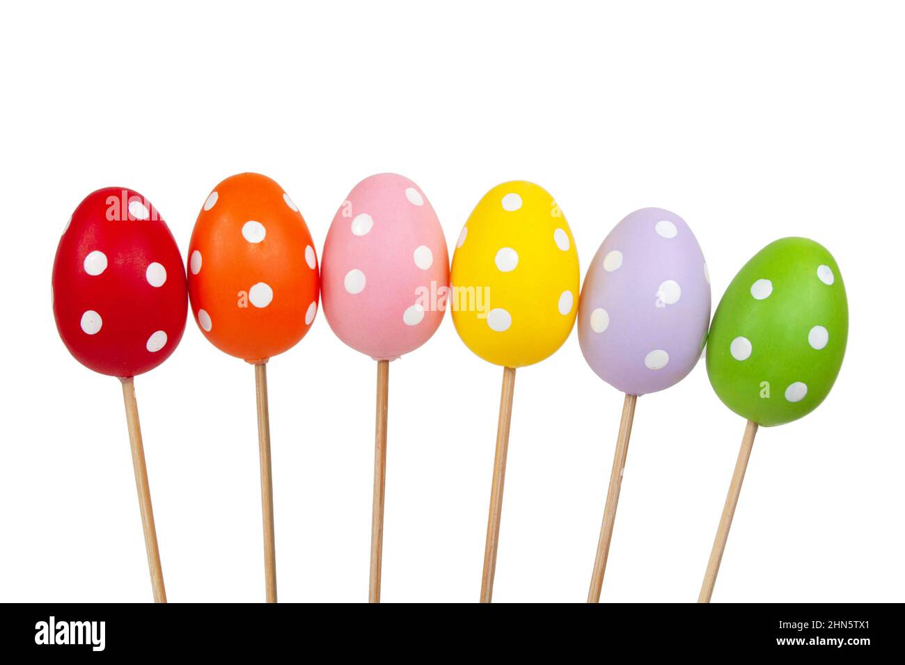 Multicolored easter eggs in dots isolated on the white background Stock Photo