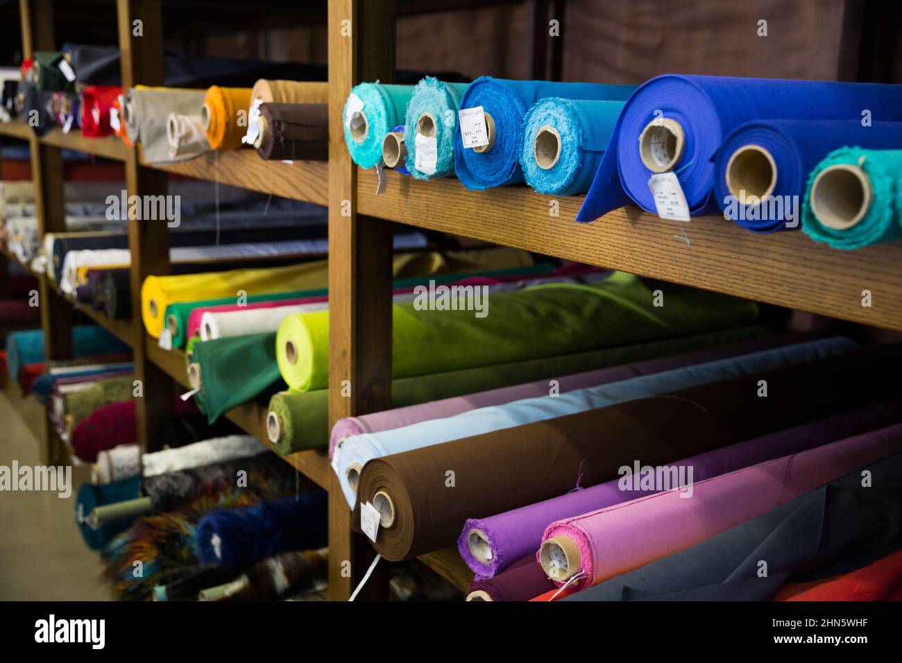 Variety of fabric bolts in shop Stock Photo Alamy