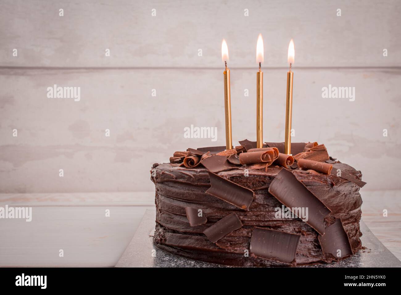 chocolate birthday cake with candles Stock Photo - Alamy