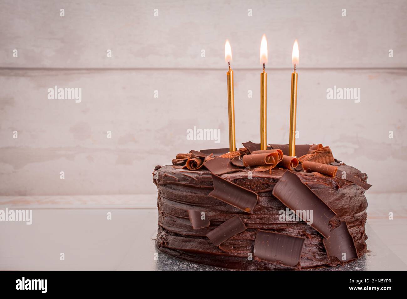 chocolate birthday cake with candles Stock Photo - Alamy