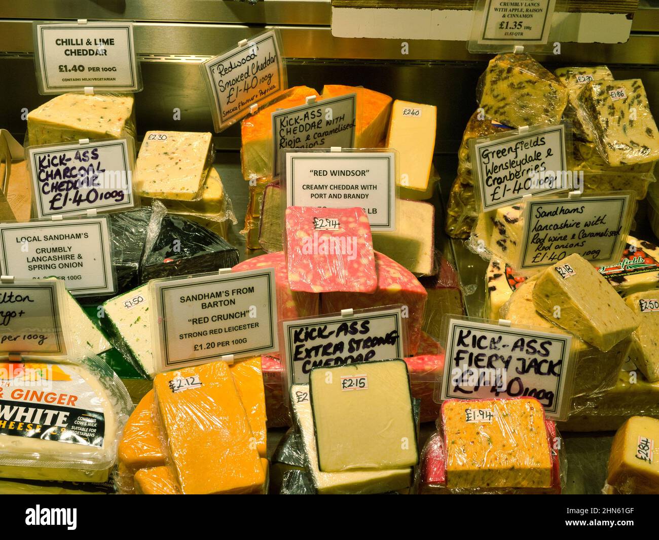 A display of local speciality cheeses at the counter of Pickles of