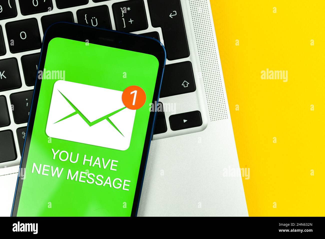 New message icon on mobile phone screen. Business communication ...