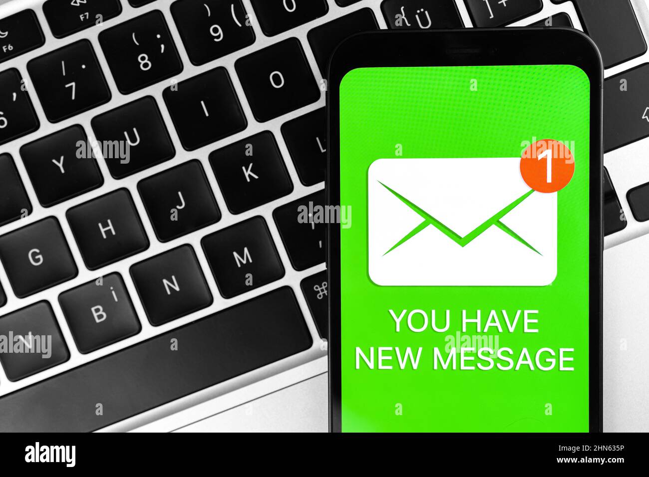 New message icon on mobile phone screen. Business communication ...