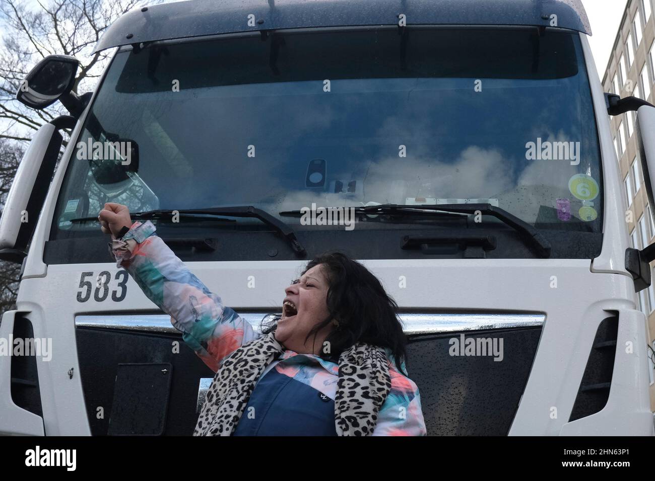 Brussels, Belgium. 14th Feb, 2022. Protesters shout slogans during an unauthorised demonstration of Freedom Convoy against coronavirus disease (COVID-19) in Brussels, Belgium on February 14, 2022. Credit: ALEXANDROS MICHAILIDIS/Alamy Live News Stock Photo