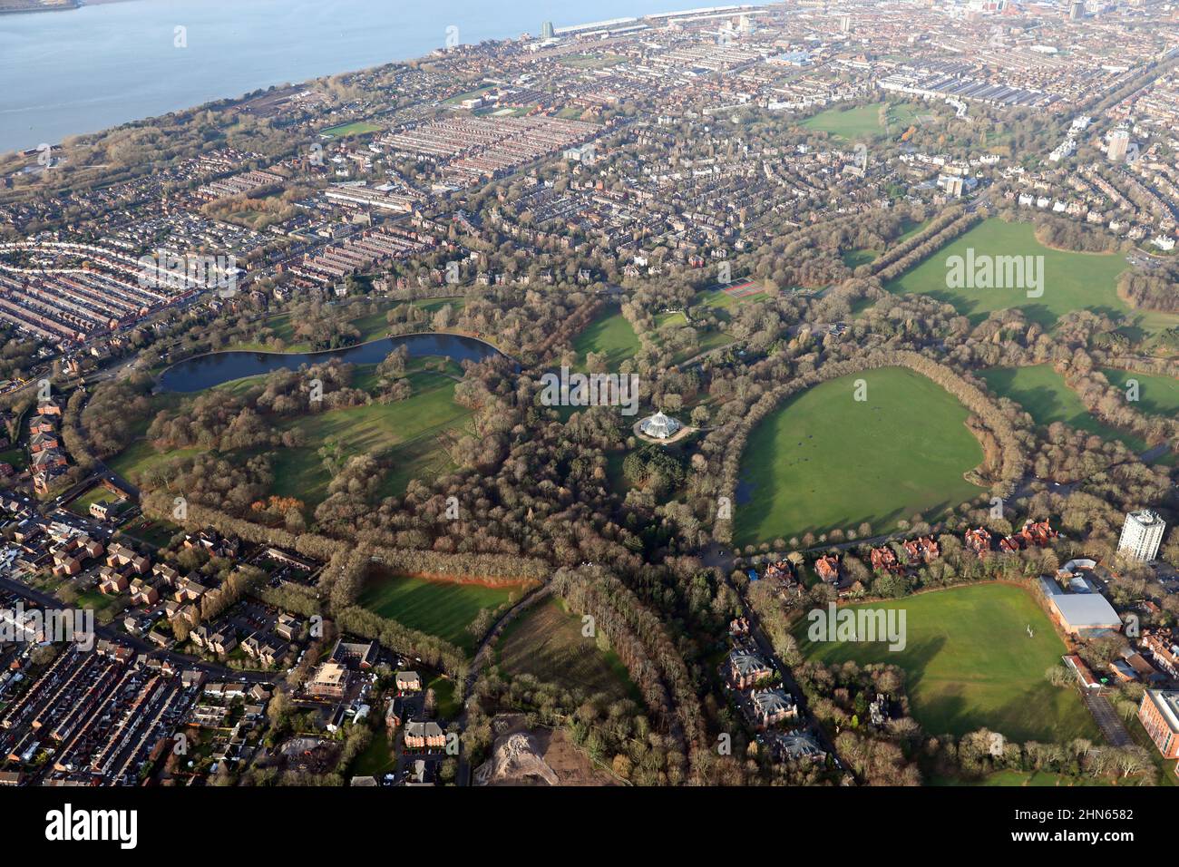 aerial view of Sefton Park (with the Sefton Park Palm House prominent) looking North towards the Liverpool city centre skyline Stock Photo