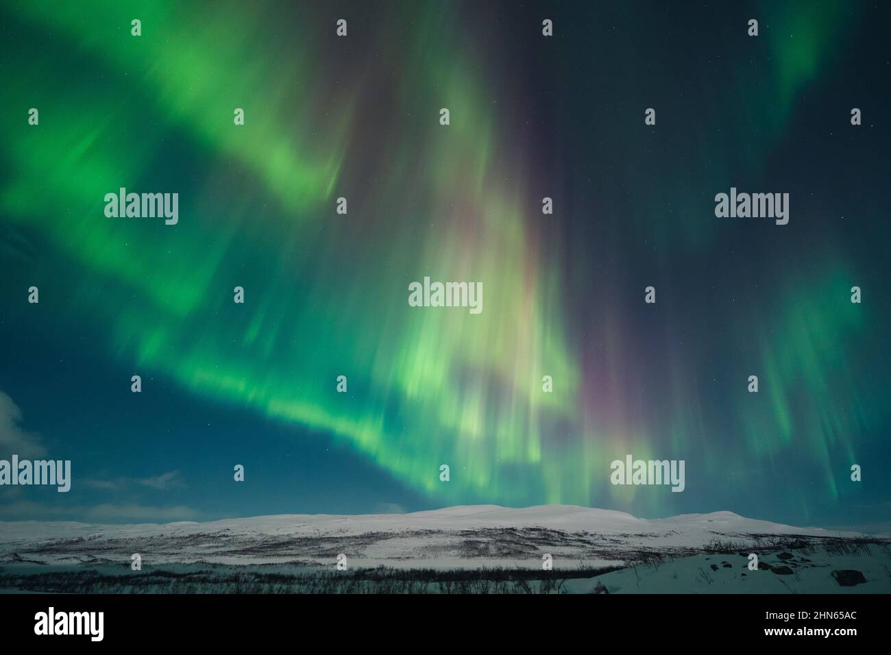 A colourful Northern Lights also know as Aurora Borealis in the northern Scandinavia Stock Photo