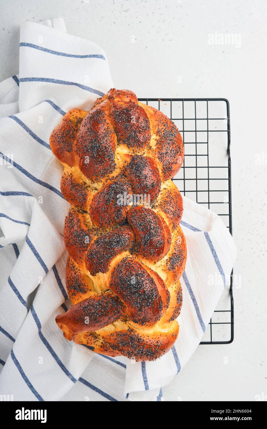 Hot plate for the Sabbath. Pot with traditional food and challah-special  bread in Jewish cuisine. Traditional food Jewish Shabbat Stock Photo - Alamy