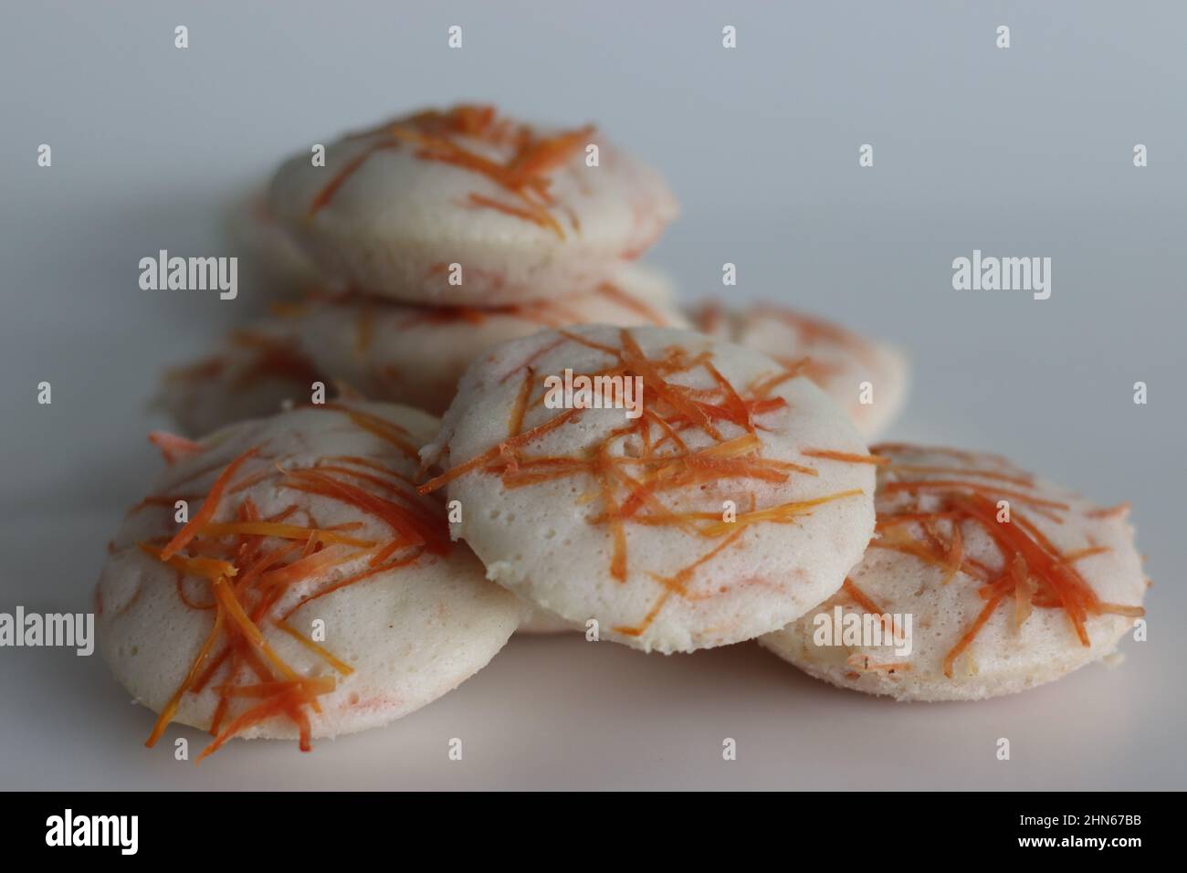 Carrot Idly. Steamed rice cakes with grated carrots. Shot on white background Stock Photo