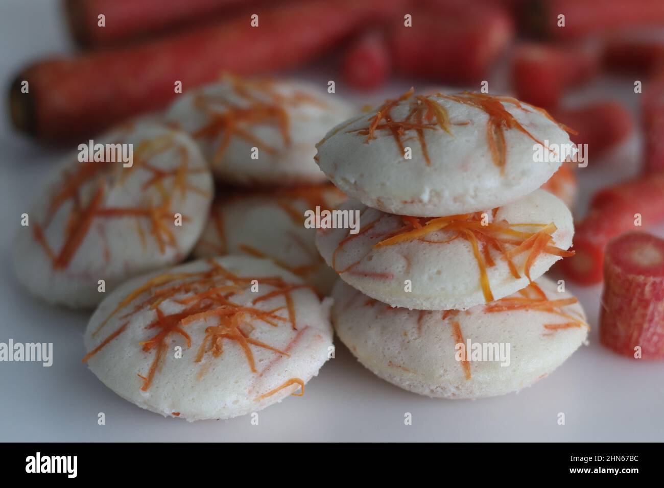 Carrot Idly. Steamed rice cakes with grated carrots. Shot on white background Stock Photo