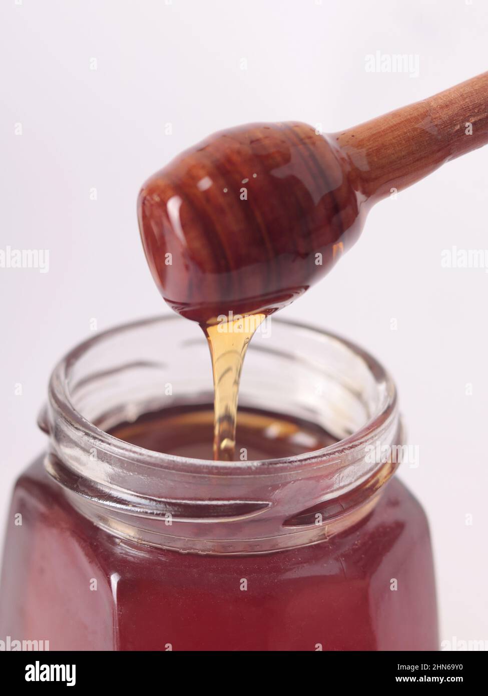 Honey in a jar, white background Stock Photo
