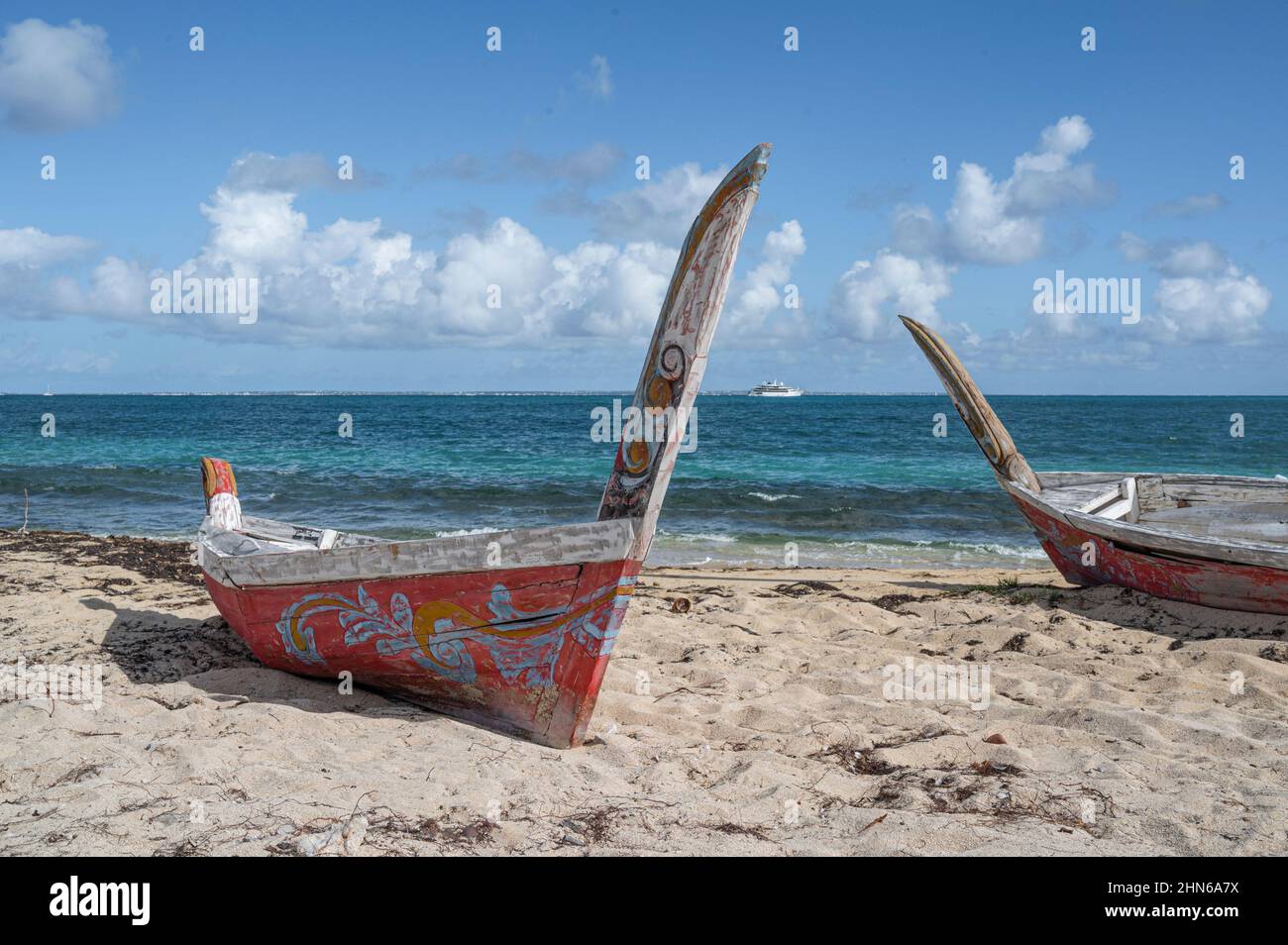 Traditional wooden boats, seen on the beach of Nettle Bay / Baie Nettlé on the French side of the island Saint-Martin / Sint Maarten Stock Photo