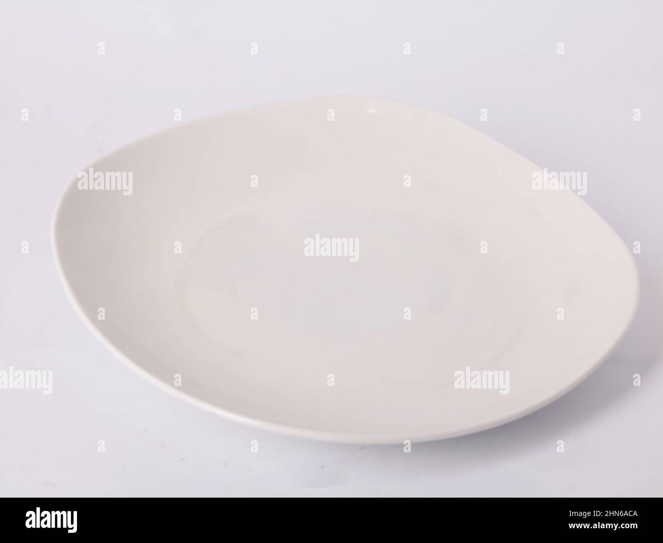 white empty plate isolated on white background Stock Photo - Alamy