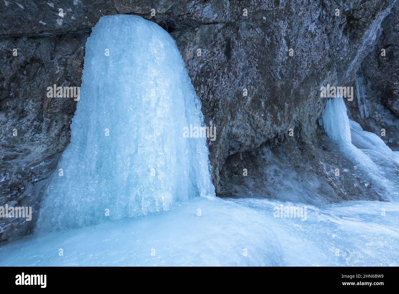 Detail of a winter landscape, icefall on a rock wall. Stock Photo