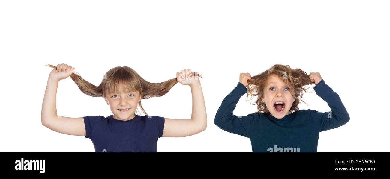 Two excited children pulling their hair out isolated on a white background Stock Photo