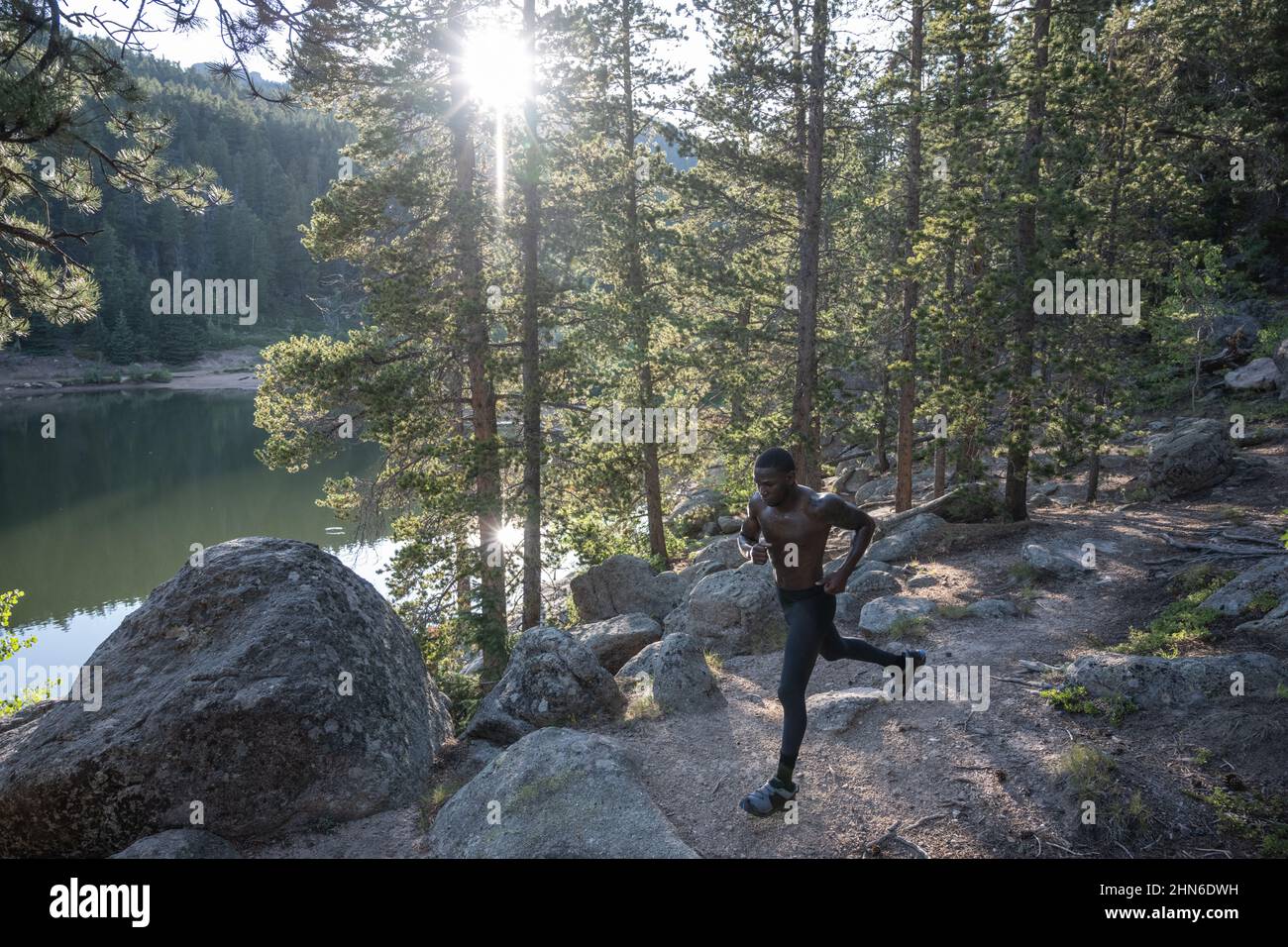 Trail Running in the woods in Colorado Stock Photo