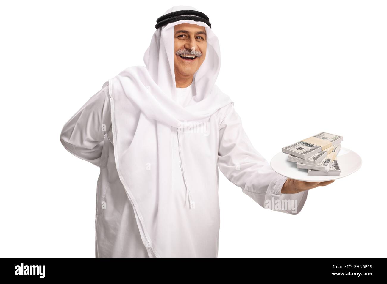 Mature arab man holding a plate with money isolated on white background Stock Photo