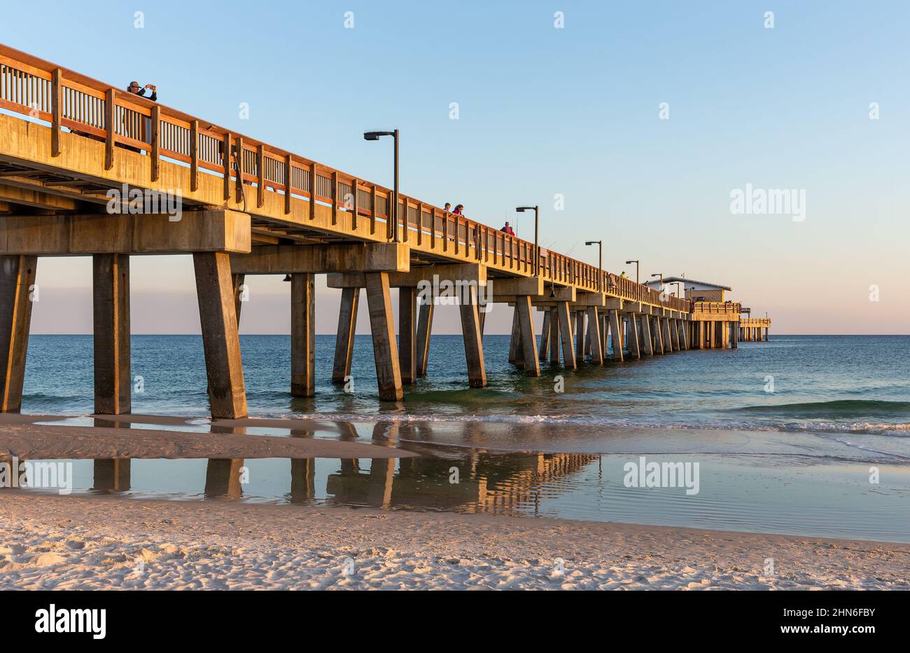 Gulf Shores, AL - March 6, 2021: The Gulf State Park Pier is a popular destination due to its scenic views and fishing opportunities.  The pier was da Stock Photo