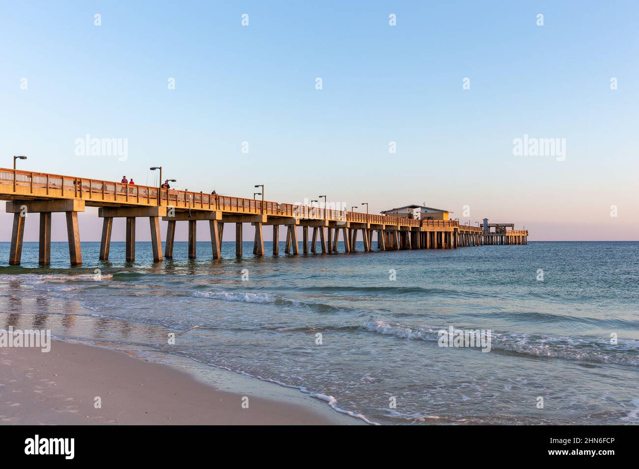 Gulf Shores, AL - March 6, 2021: The Gulf State Park Pier is a popular destination due to its scenic views and fishing opportunities.  The pier was da Stock Photo