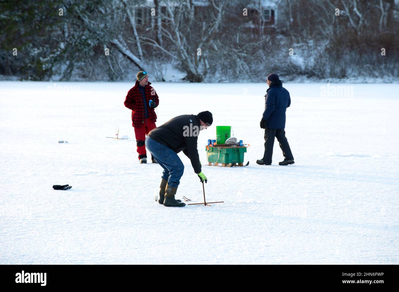 Ice fishing on Scargo Lake, Dennis, Massachusetts, on Cape Cod, USA